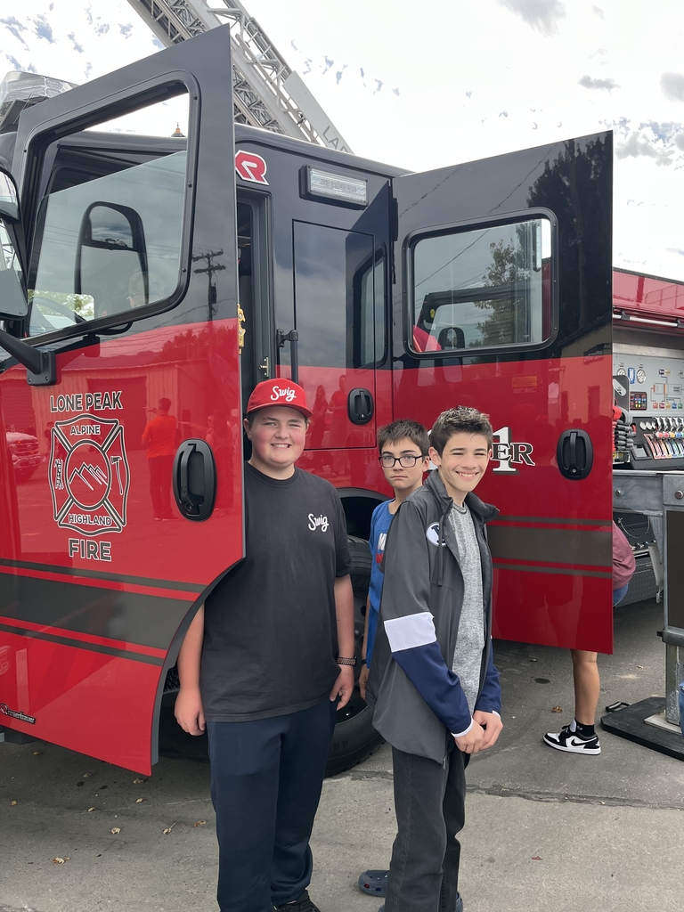 Students talking to firefighters