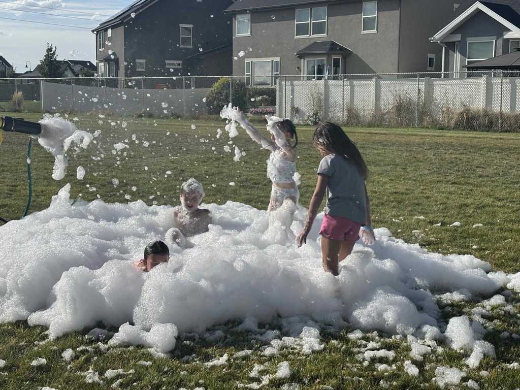 Students playing in the foam.