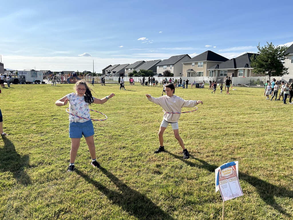 Students playing with hula hoops.