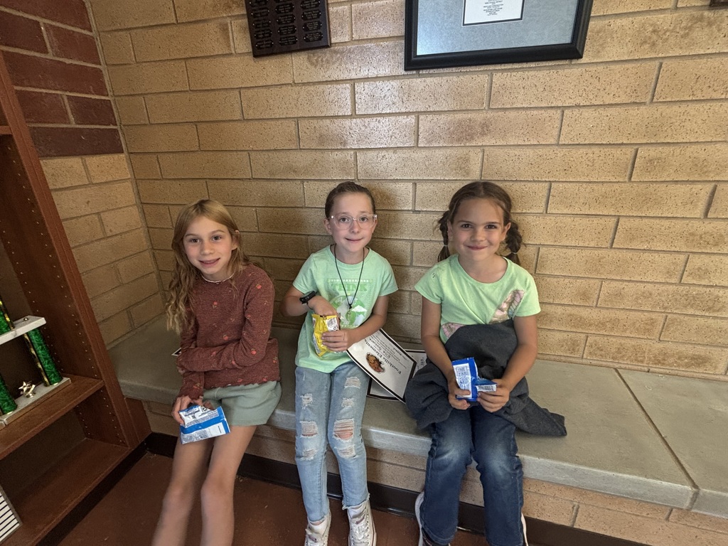 Kids eating cookies for their reward party.