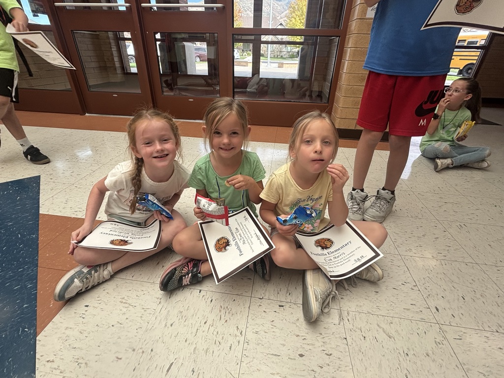 Kids eating cookies for their reward party.