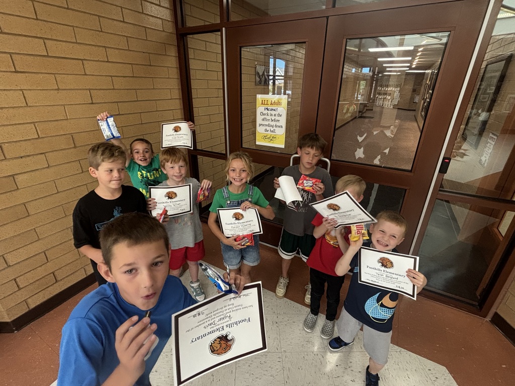 Kids eating cookies for their reward party.