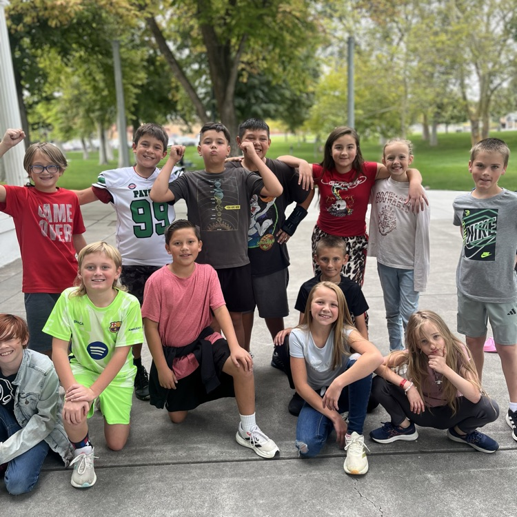 a groups of kids posing for the camera