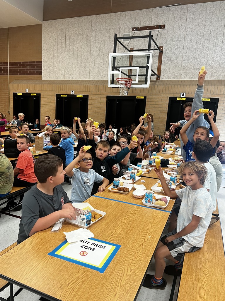 Our 5th grade students showing us corn on the cob for school lunch