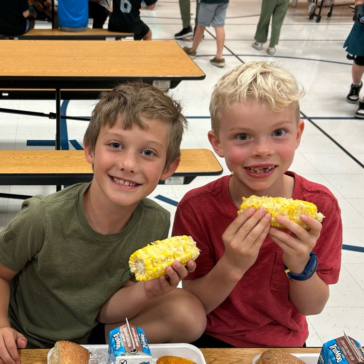 kids eating corn