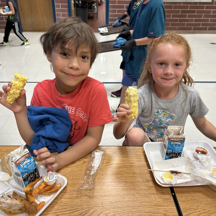 kids eating corn