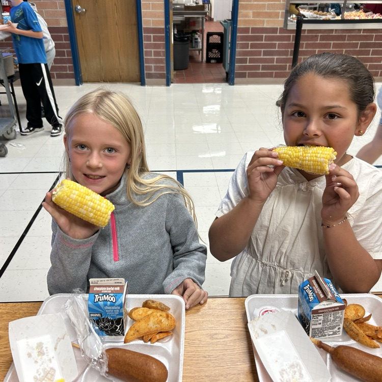 kids eating corn