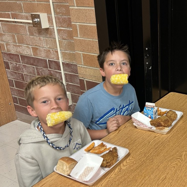 kids eating corn