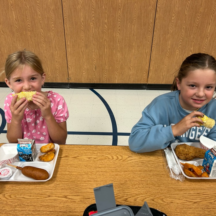 kids eating corn
