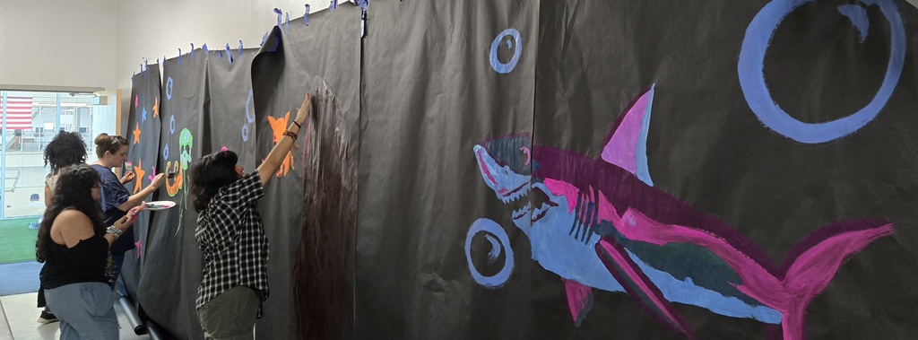 Art Students paint the spin room at the Clyde Rec Center