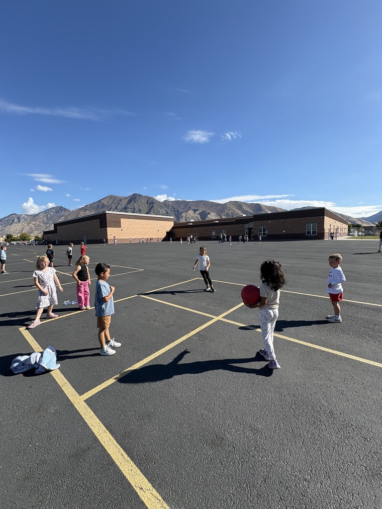students playing four square