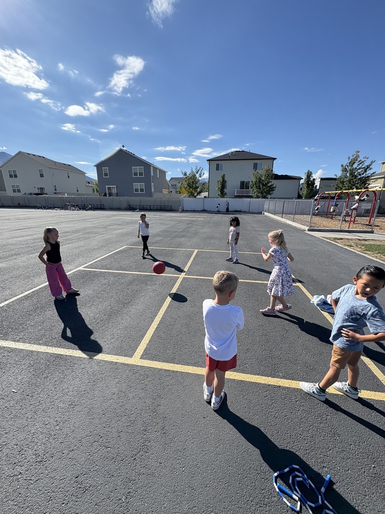 students playing four square