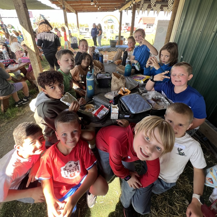 students eating their lunch and showing off for the camera.