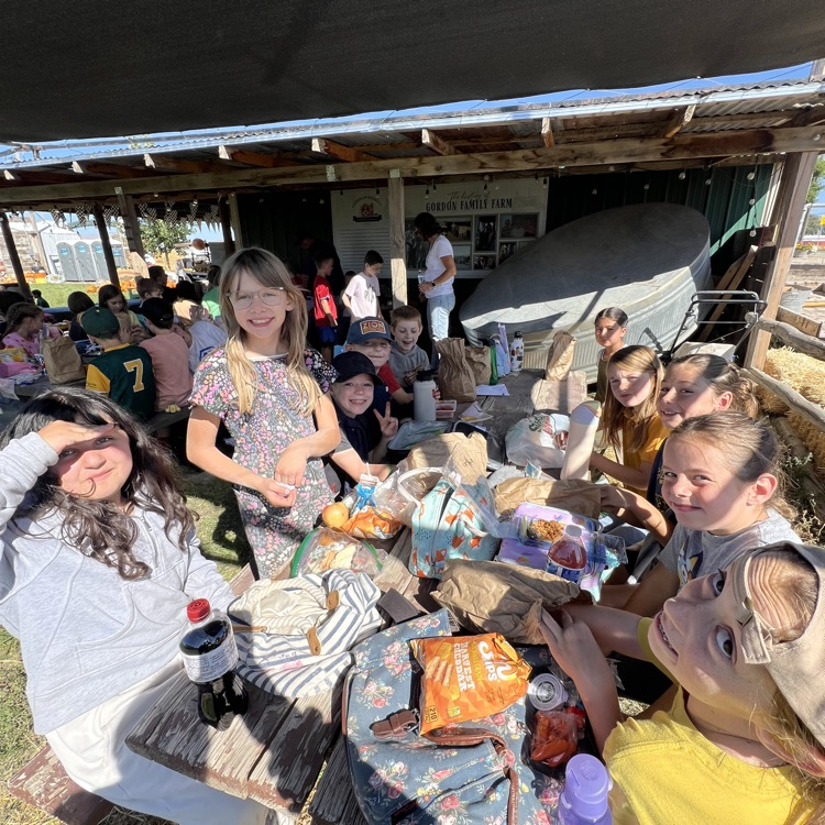 students eating their lunch and showing off for the camera.