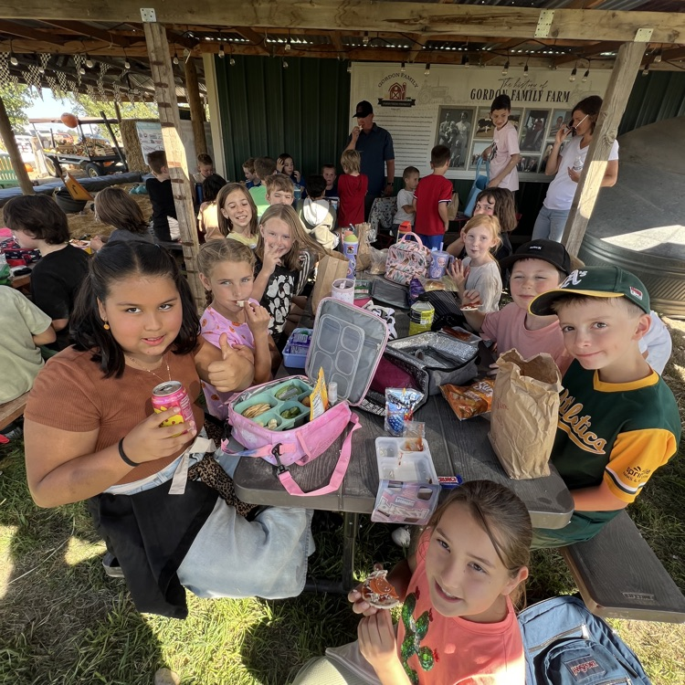 students eating their lunch and showing off for the camera.