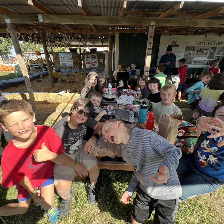 students eating their lunch and showing off for the camera.
