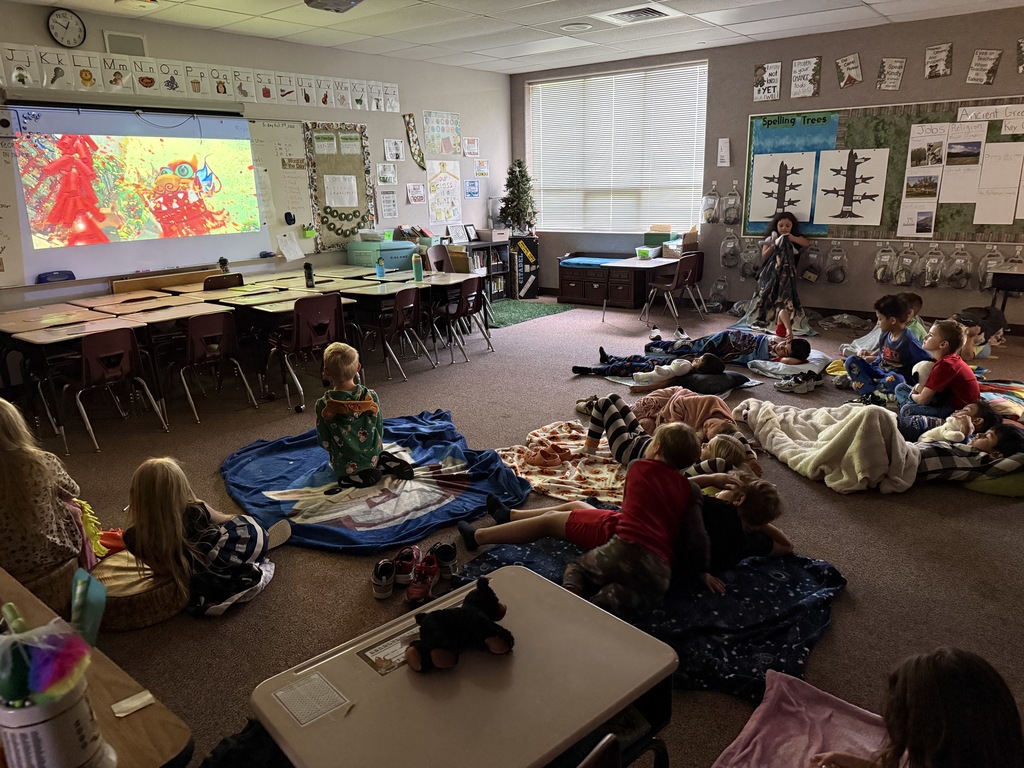 2nd grade students celebrating end of term by watching kung fu