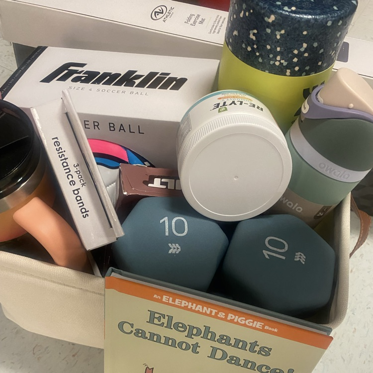 a basket with weights and other exercise equipment