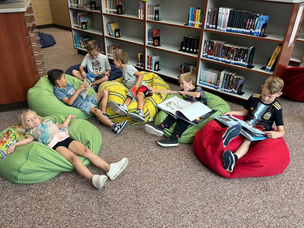 students reading on bean bags