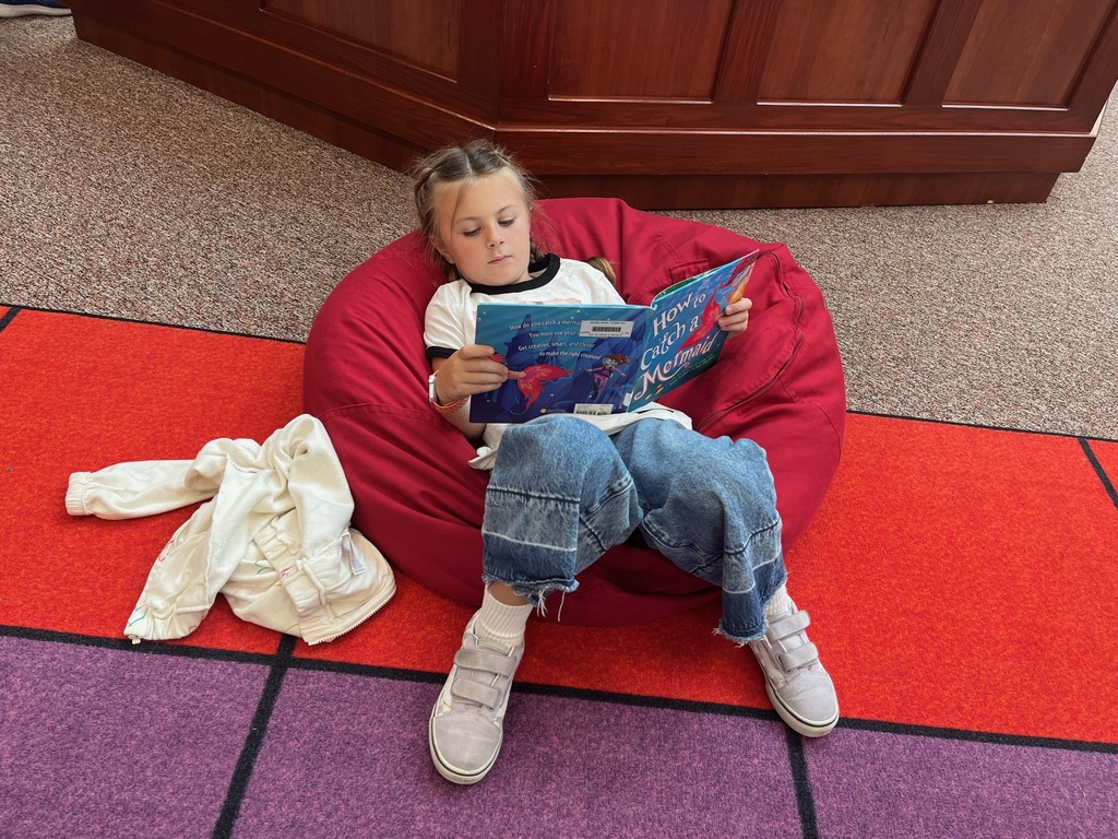 student reading in a bean bag