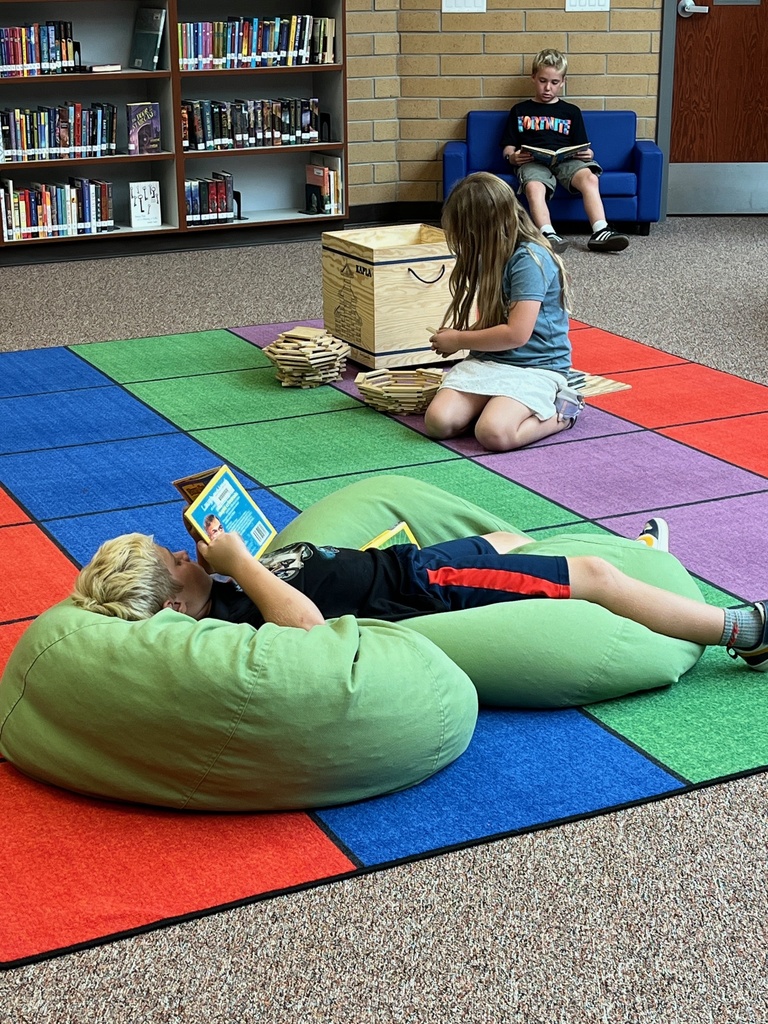 student reading on a bean bag