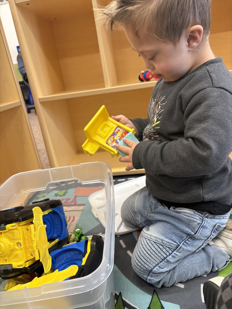 student playing with toys