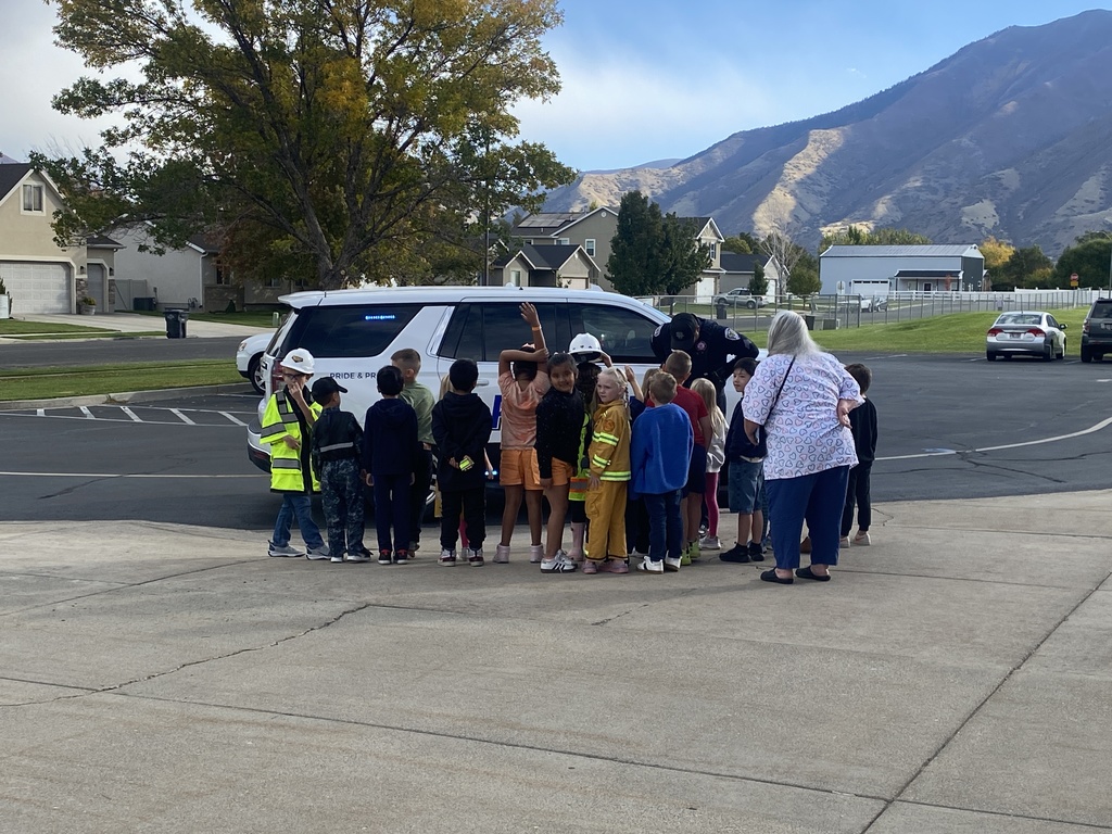 Ms. Nilson's class looking at a Police car