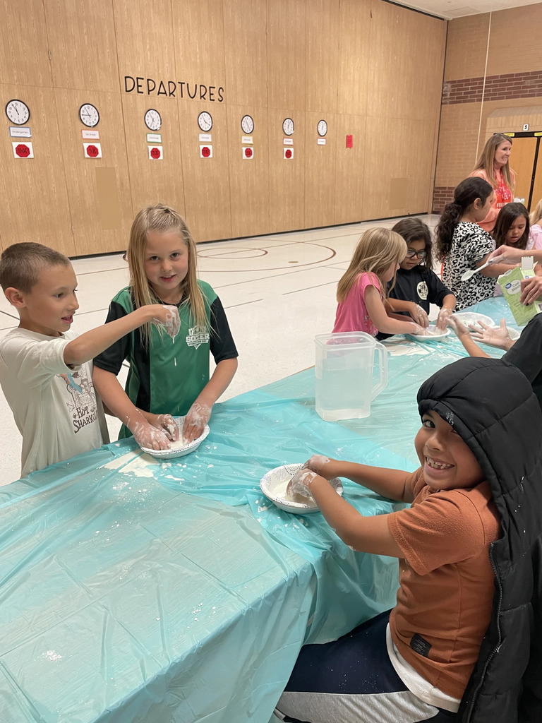 students making  oobleck and getting it everywhere