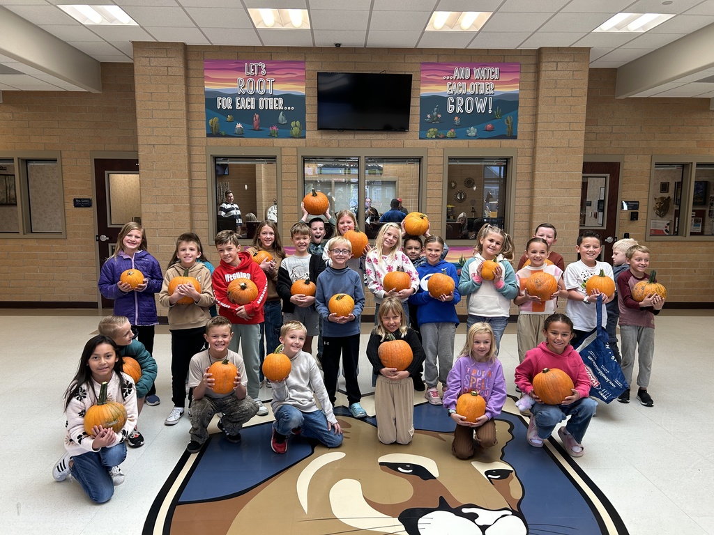 A class with their pumpkins.
