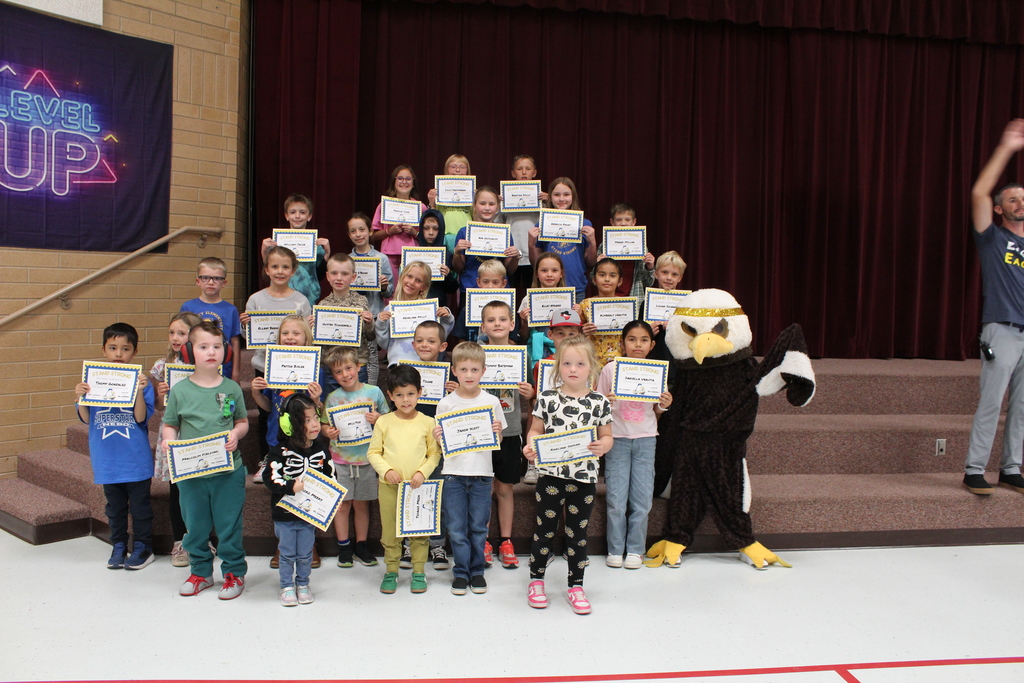 Stand Strong Students holding their certificates for Stand Strong Students of the month.
