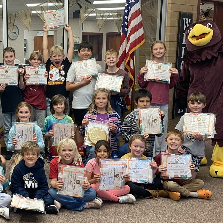 a group of students holding their certificates 