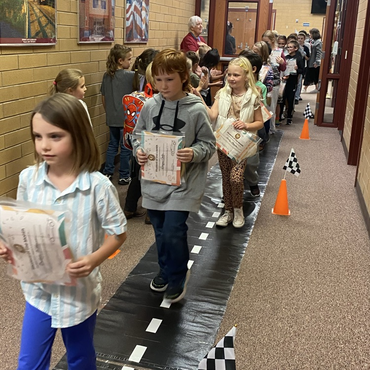 students walking down a pathway 