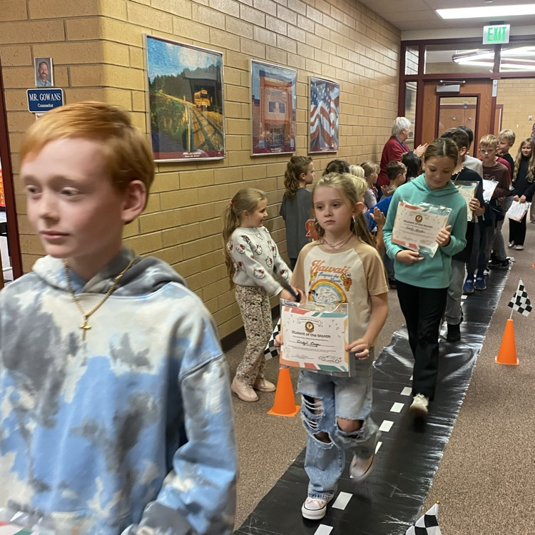 students walking down the hall 