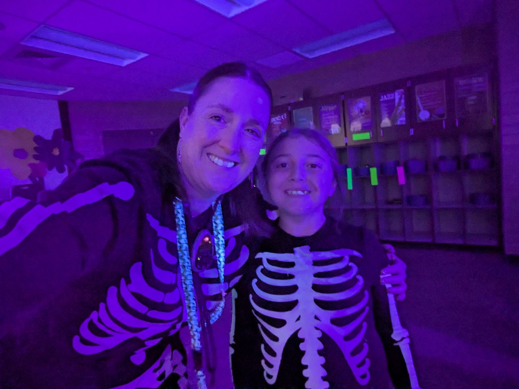 teacher posing with a student