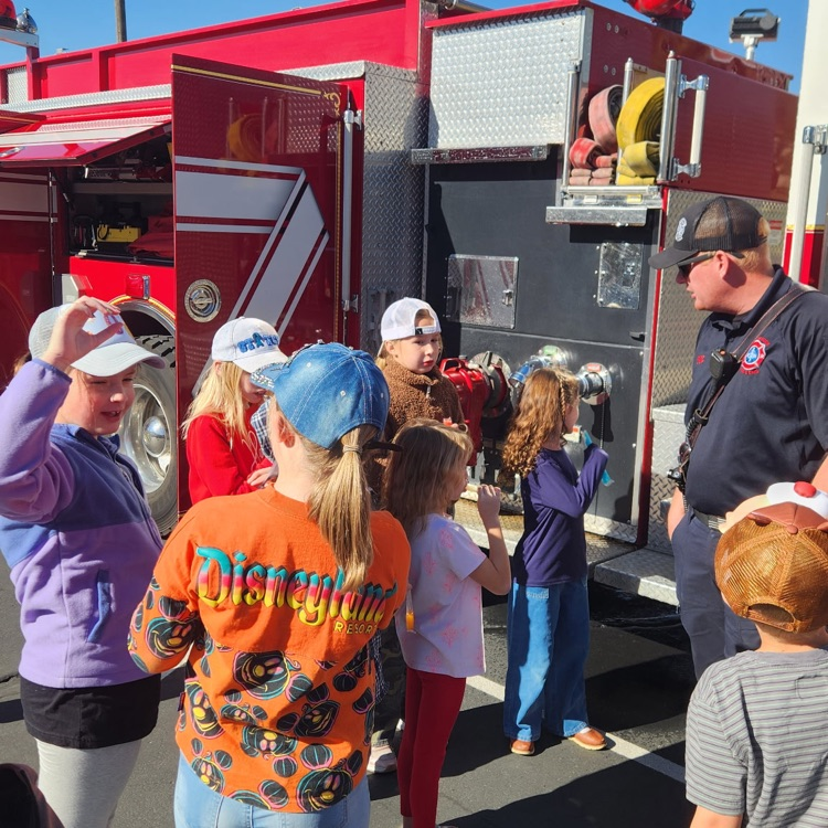 kids looking at fire truck