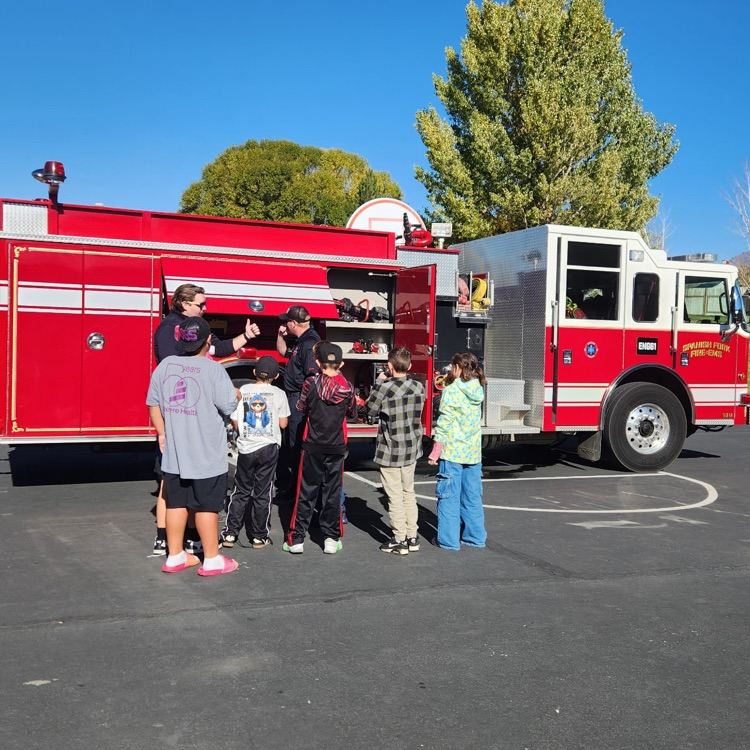kids talking with fireman
