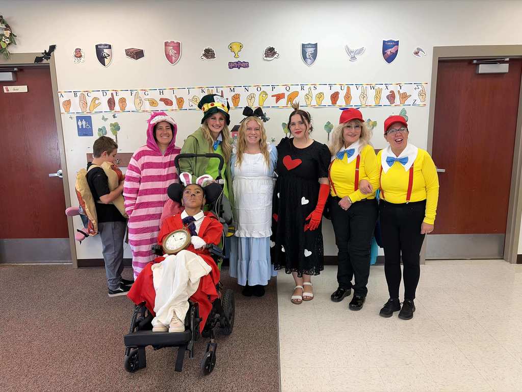 EEC teachers dressed up as Alice in Wonderland.