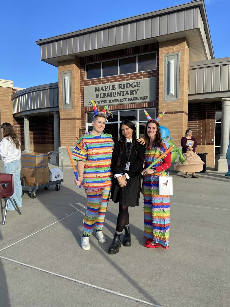 Special Ed teachers dressed up as pinatas with our speech teacher dressed up as Wednesday.