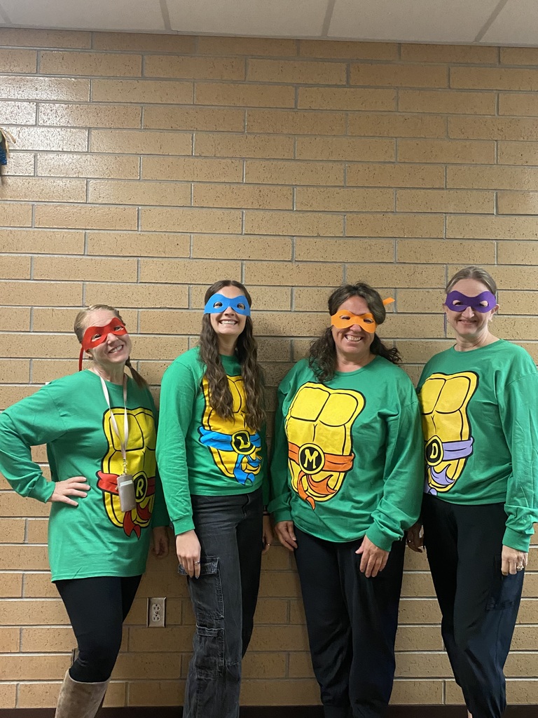 5th Grade teachers dressed up as ninja turtles.