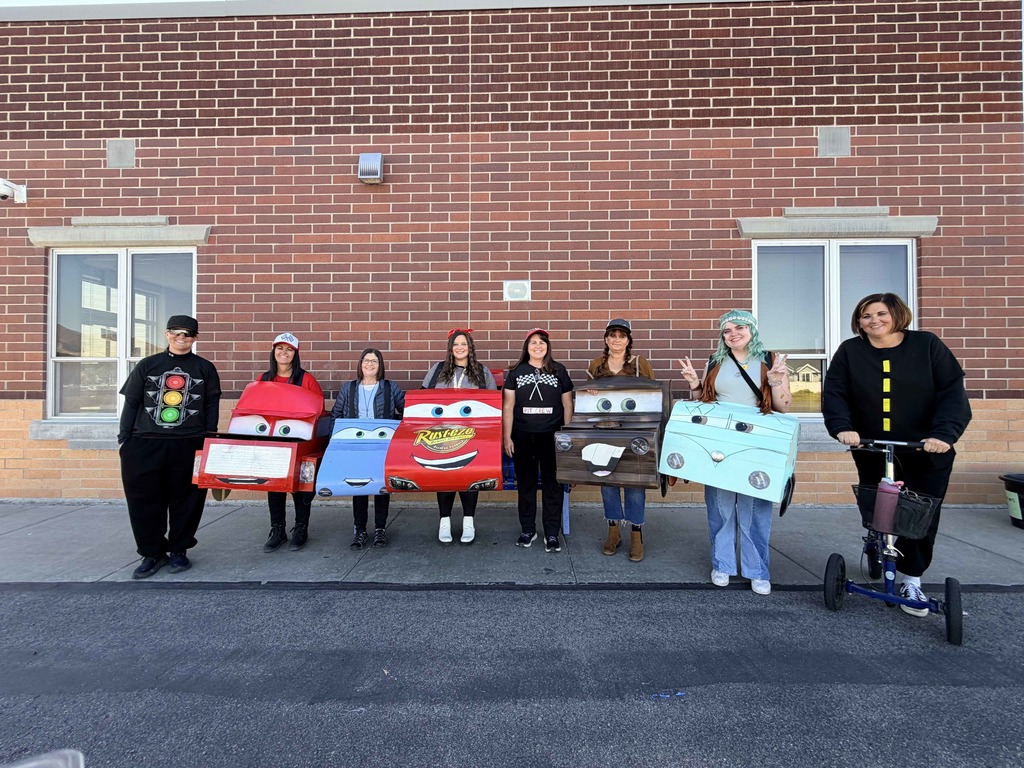 Specialty teachers and technicians dressed as characters from Cars.