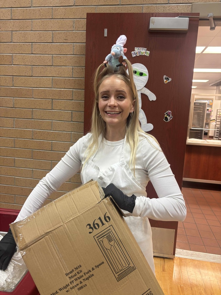 Lunch lady with Remy on her head.