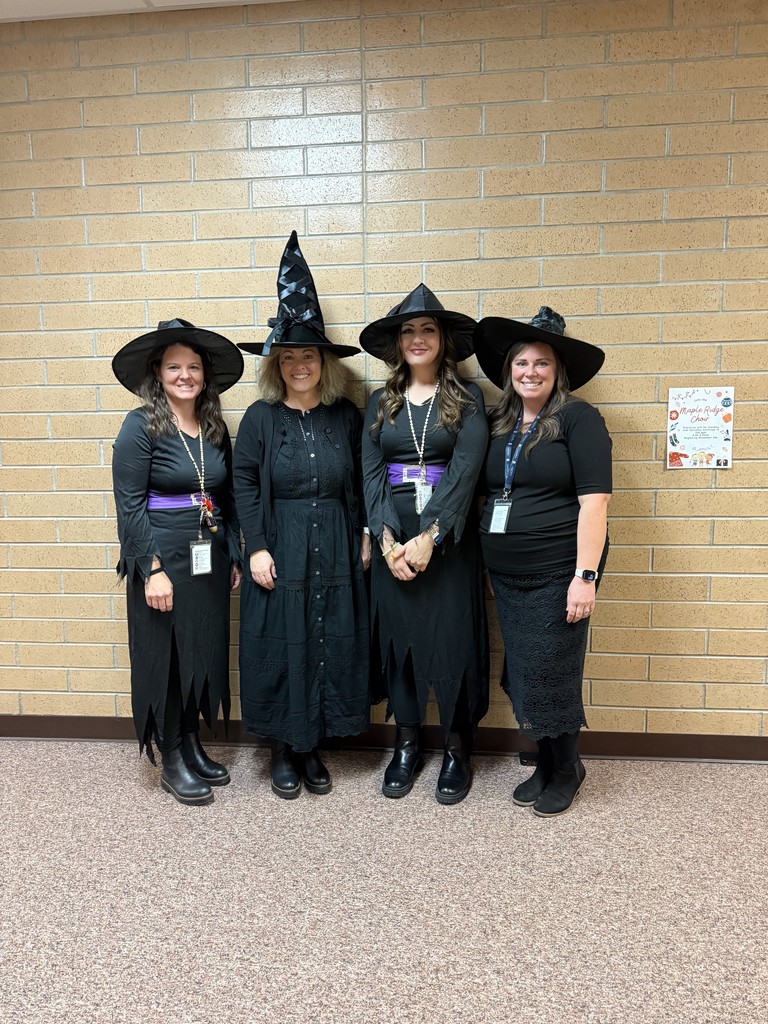 Reading Intervention teachers dressed as witches.