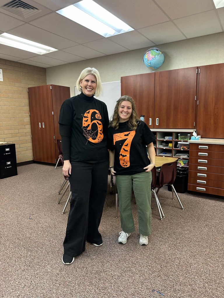 Math intervention teachers dressed up as 6/7.