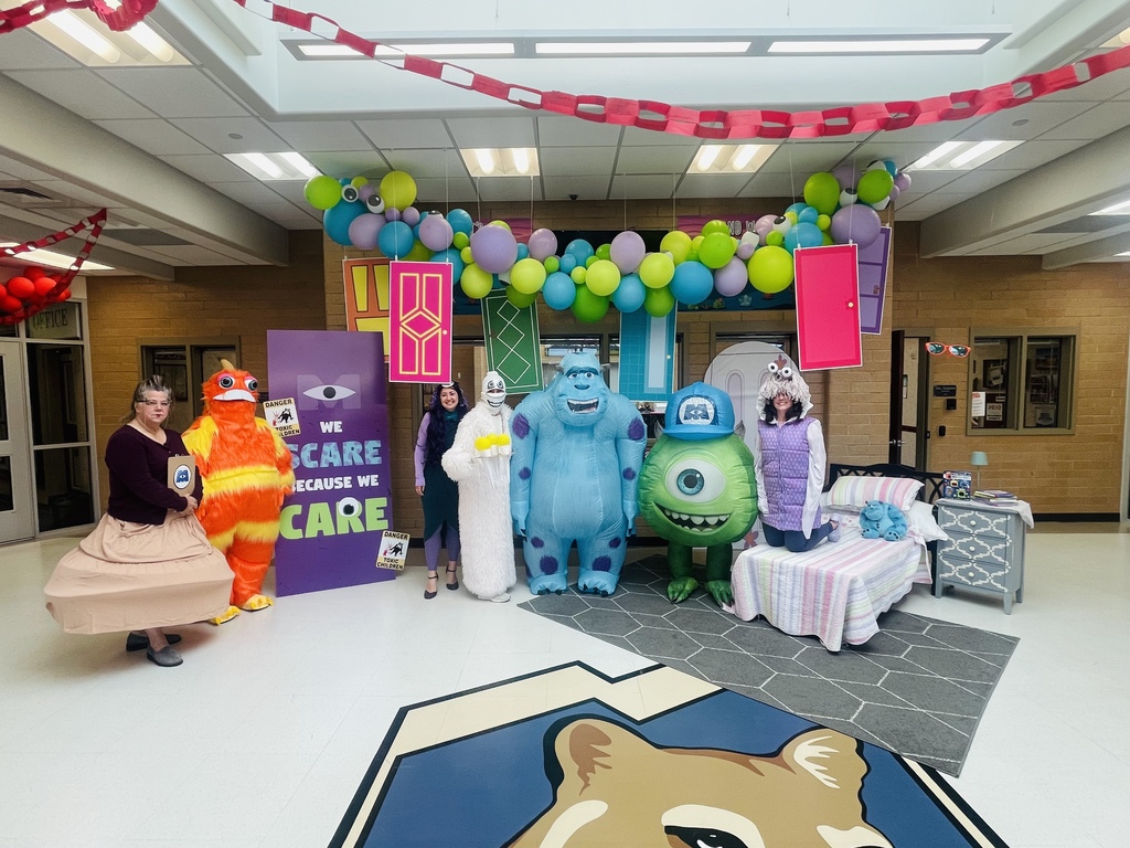 Teachers dressed as characters from Monsters Inc.