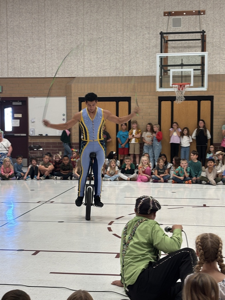 person balancing on bike and jump roping