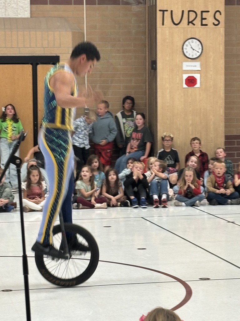person balancing on a one wheel bike and jump roping