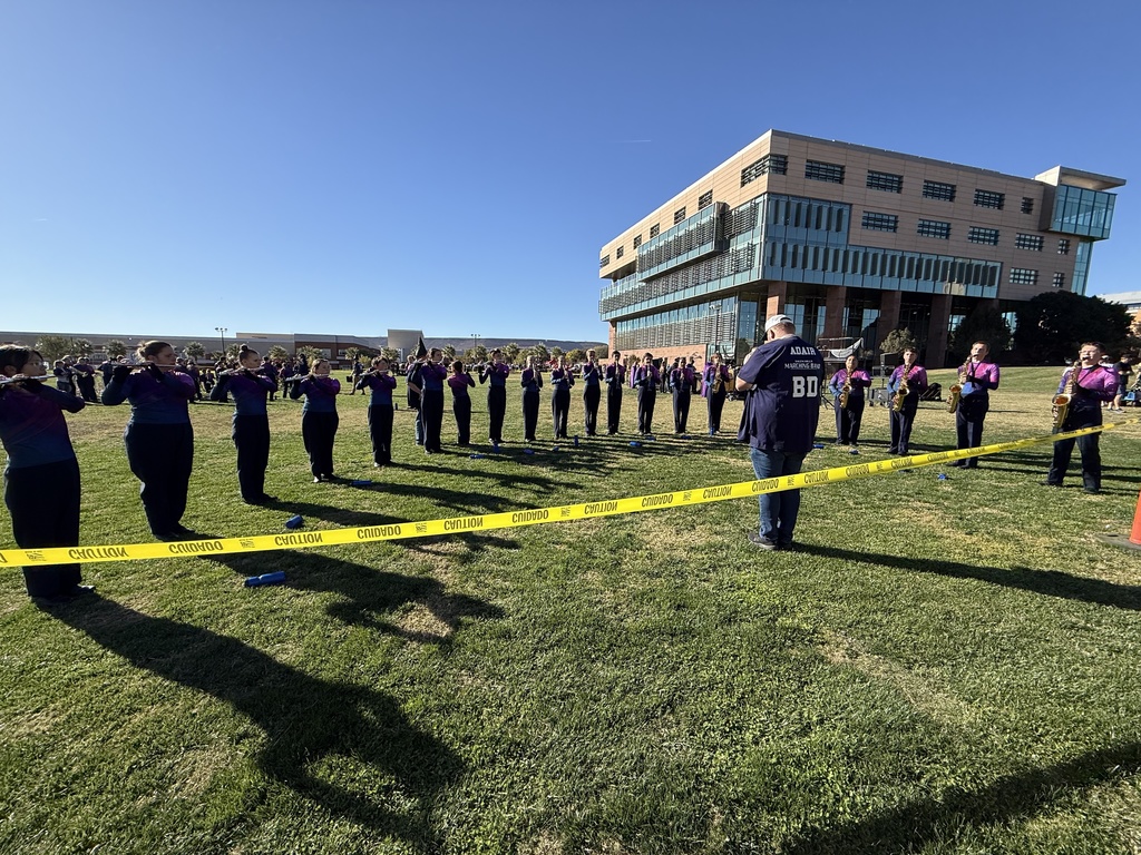 Brass Section warming up for State
