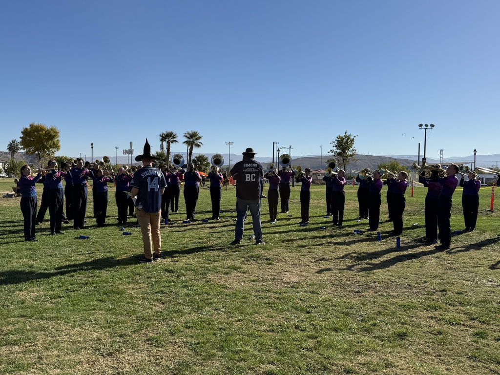 Brass Section warming up for State