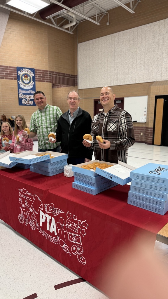 Our PTA dads helping serve donuts