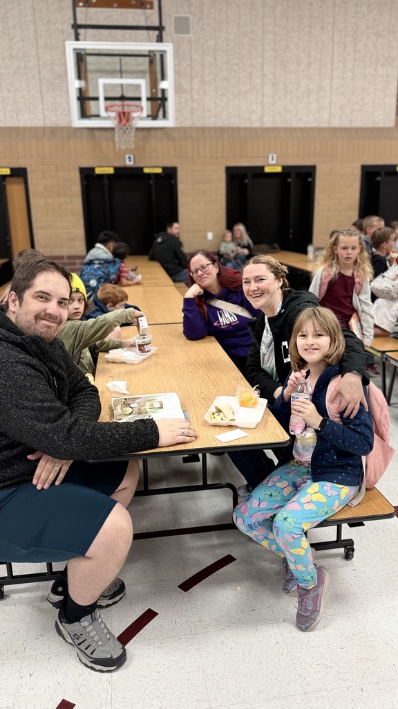 Parents having a donut with their student